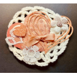 Peach heart and elements on doily