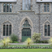 Gothic Style Building With Young Cabbage Trees